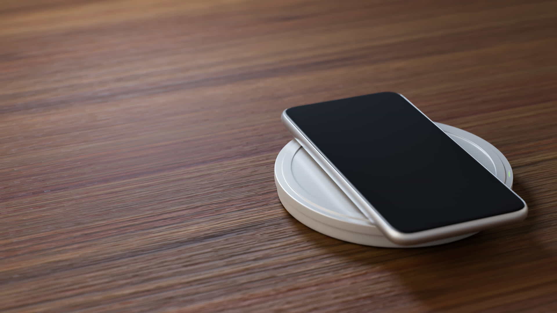 A smartphone sitting on a wireless charger.